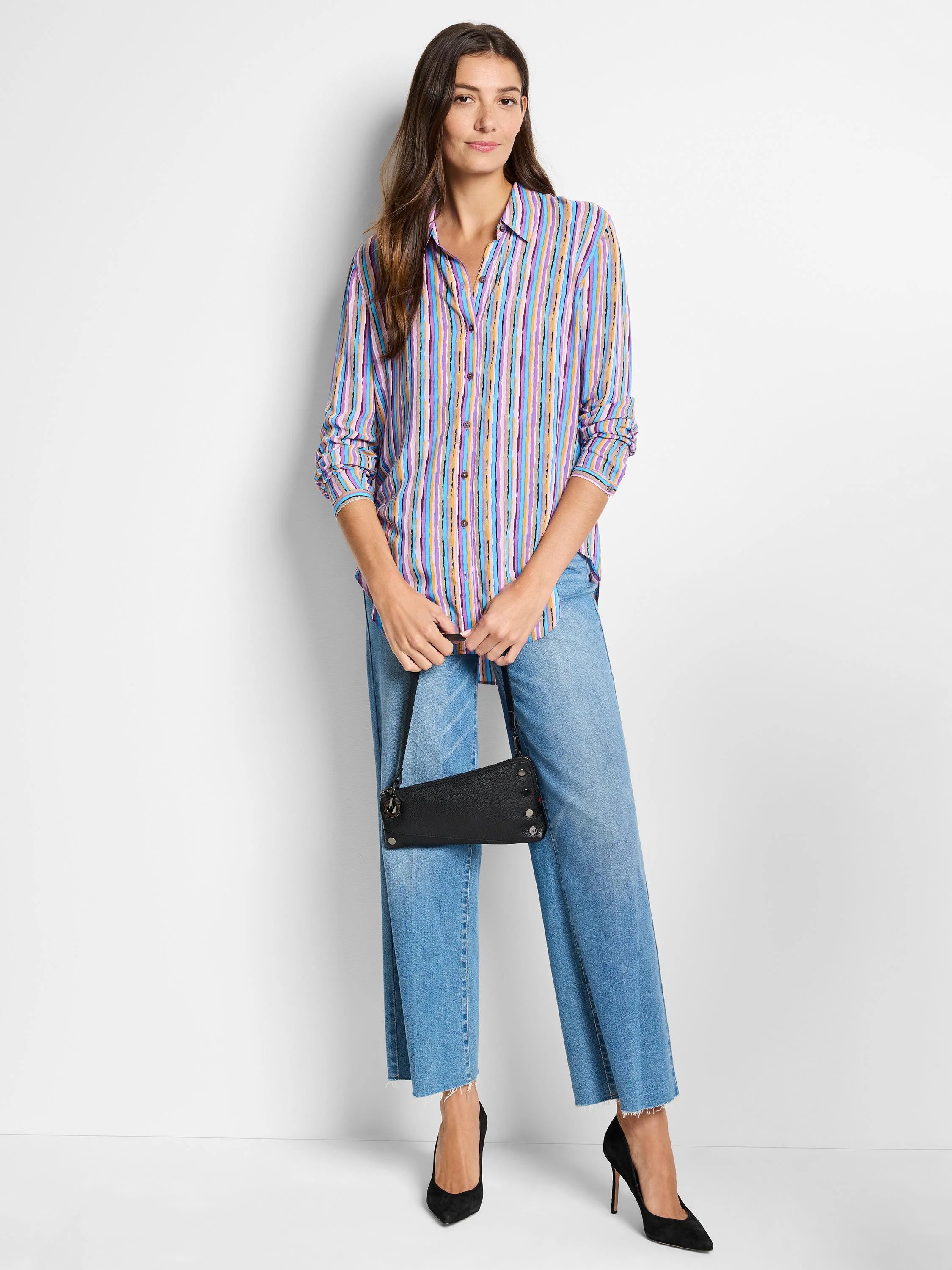 Multicolored vertical stripes on a long-sleeve collared shirt; light purple, blue, and gold tones.