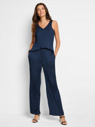 Navy blue pleated jumpsuit; sleeveless top, wide-leg pants.  V-neck.
