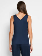 Navy blue sleeveless tank top; vertically pleated; V-neck.