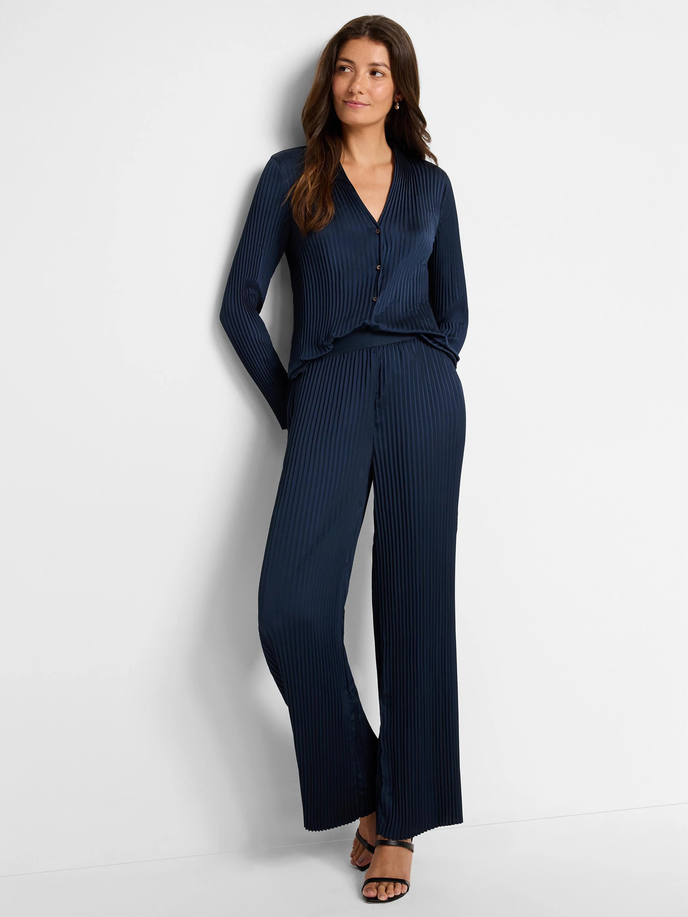 Navy blue, pleated shirt and pants set.  Long sleeves, v-neck shirt, and wide-leg pants.