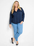 Dark navy blue, vertically pleated, long-sleeve button-down shirt.