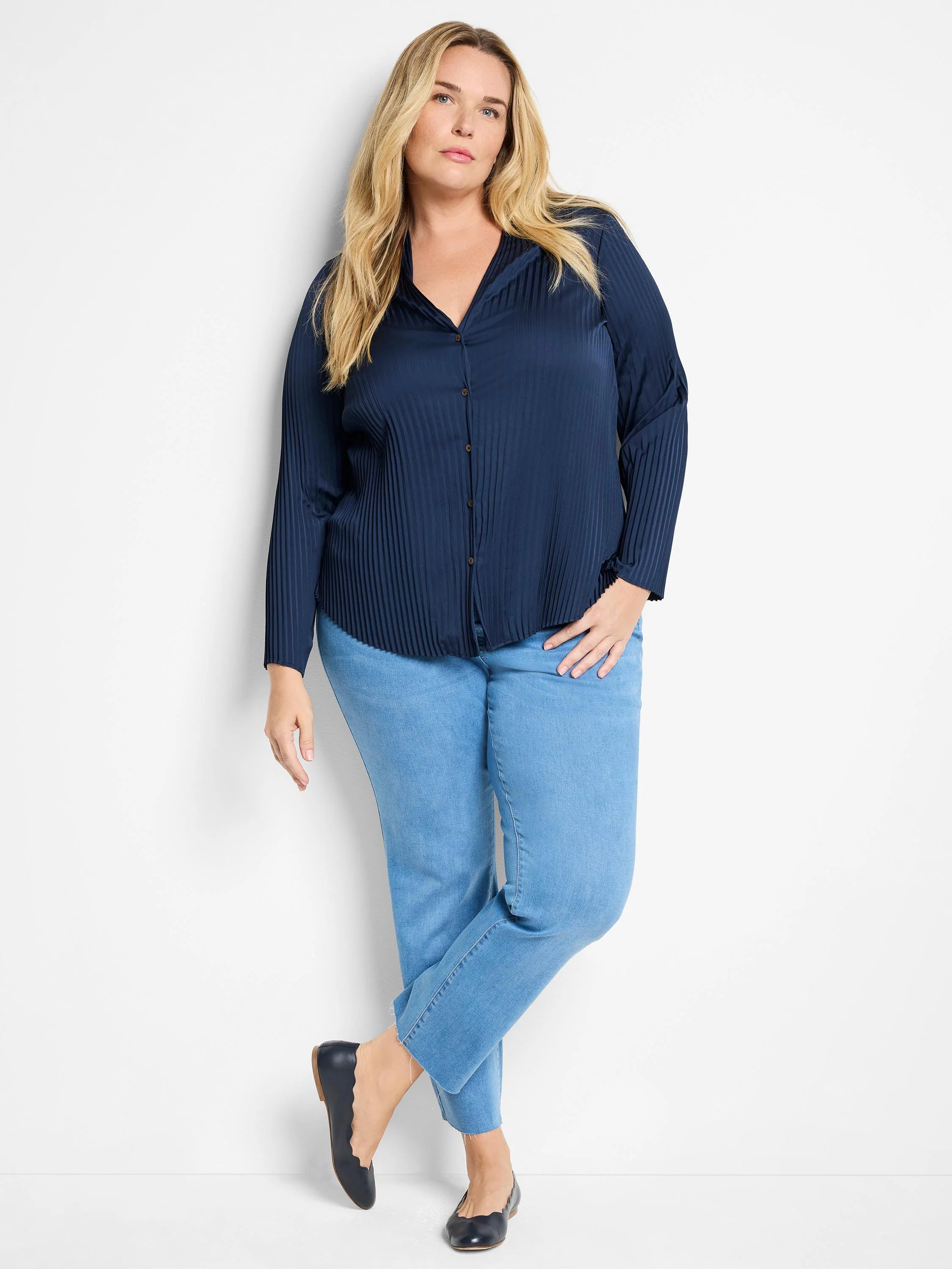 Dark navy blue, vertically pleated, long-sleeve button-down shirt.