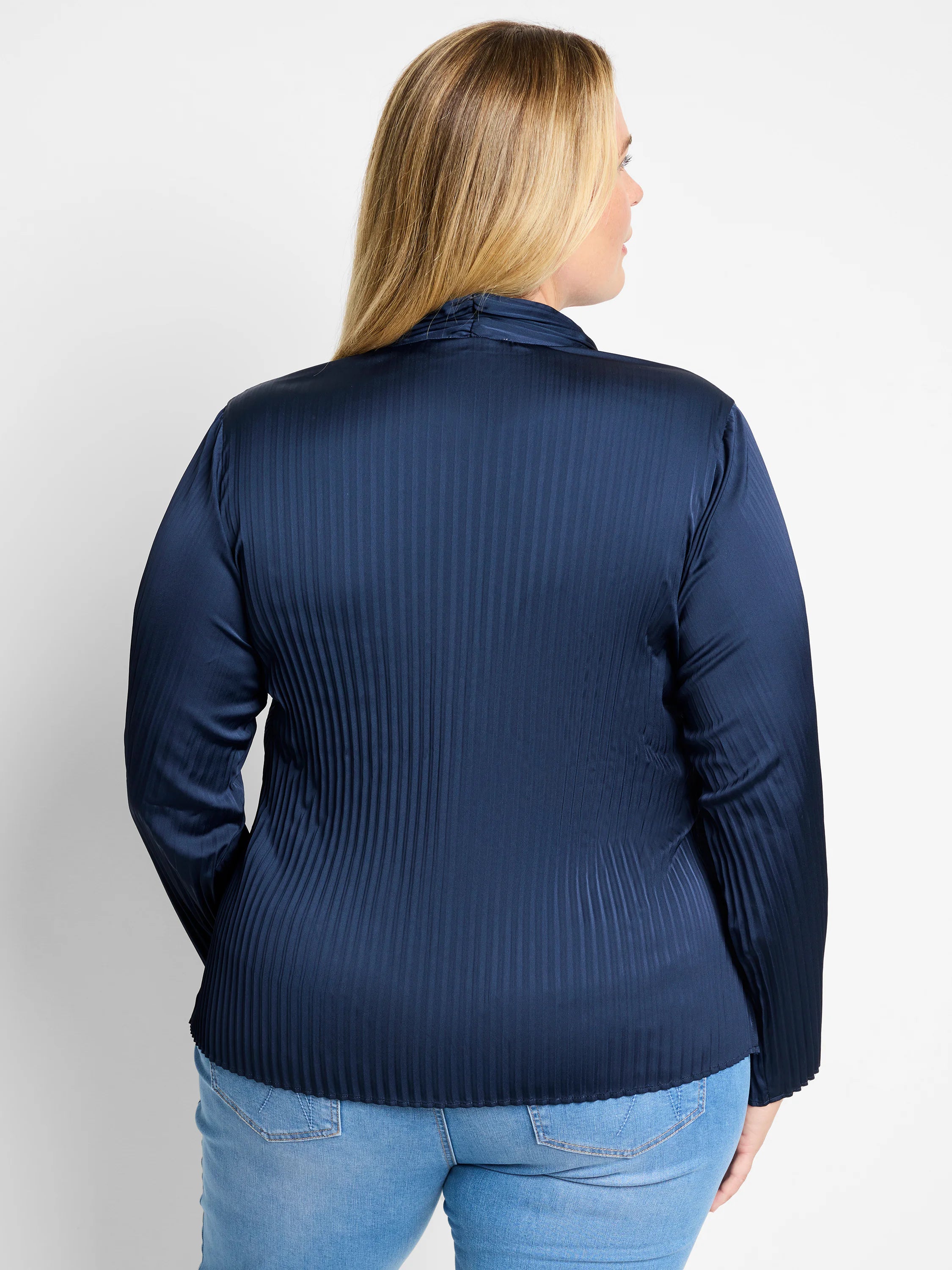 Here's alt text for the image, under 125 characters:

Dark navy blue, long-sleeved pleated shirt.  Vertical pleats;  cowl...