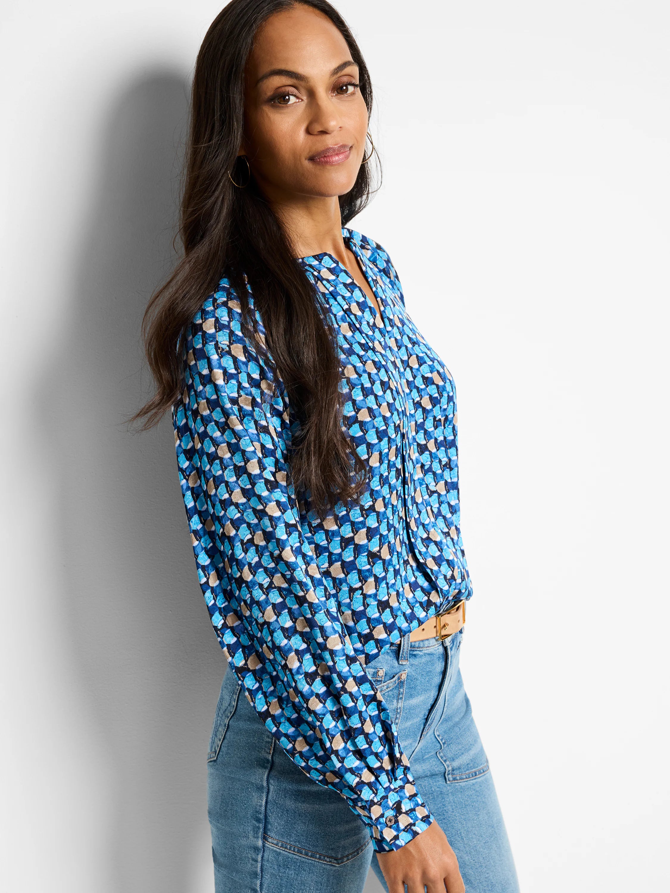 Blue, teal, and beige patterned long-sleeve blouse.  V-neck.