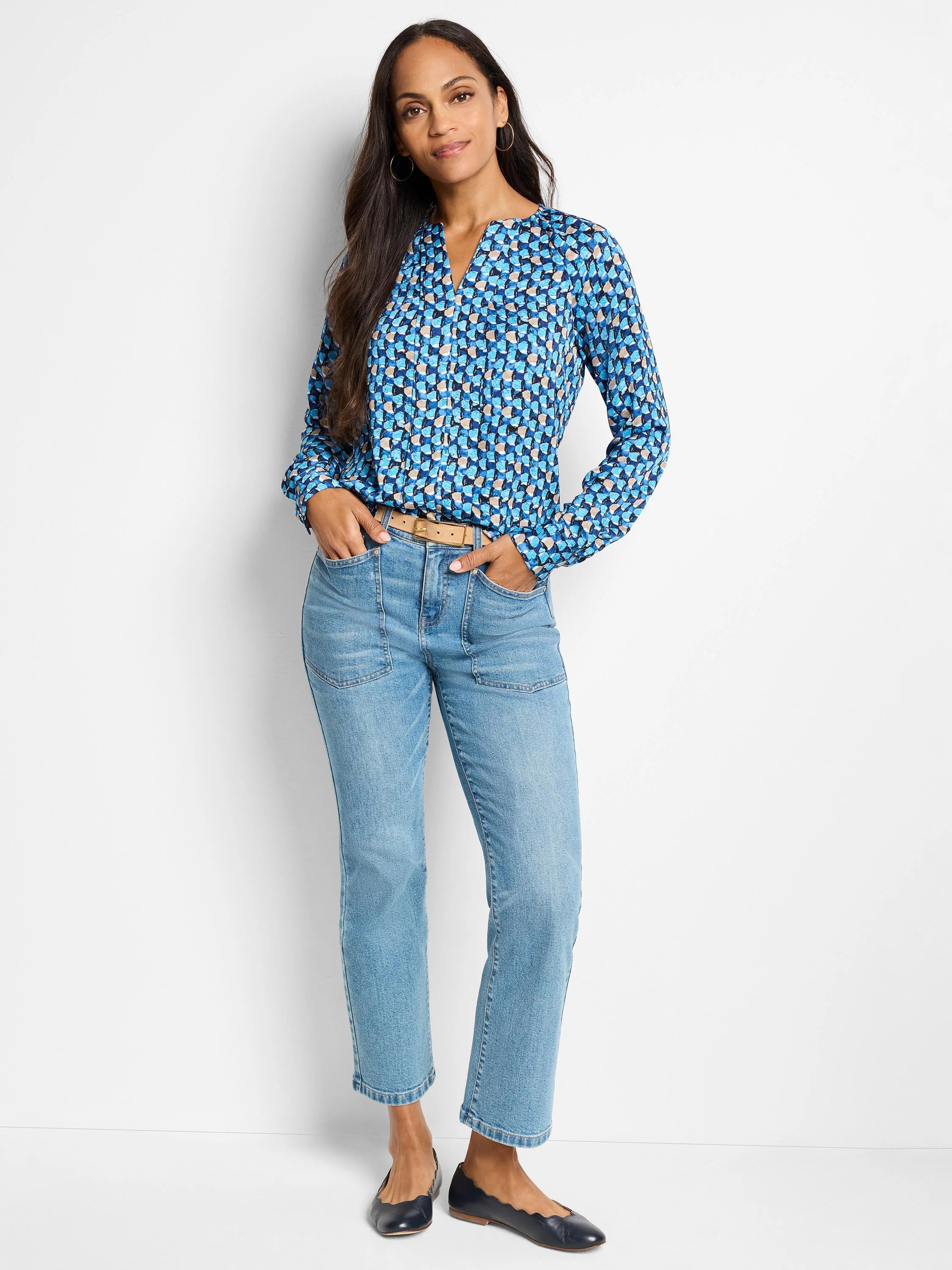 Long-sleeve blue top with teal, beige geometric print. V-neck.