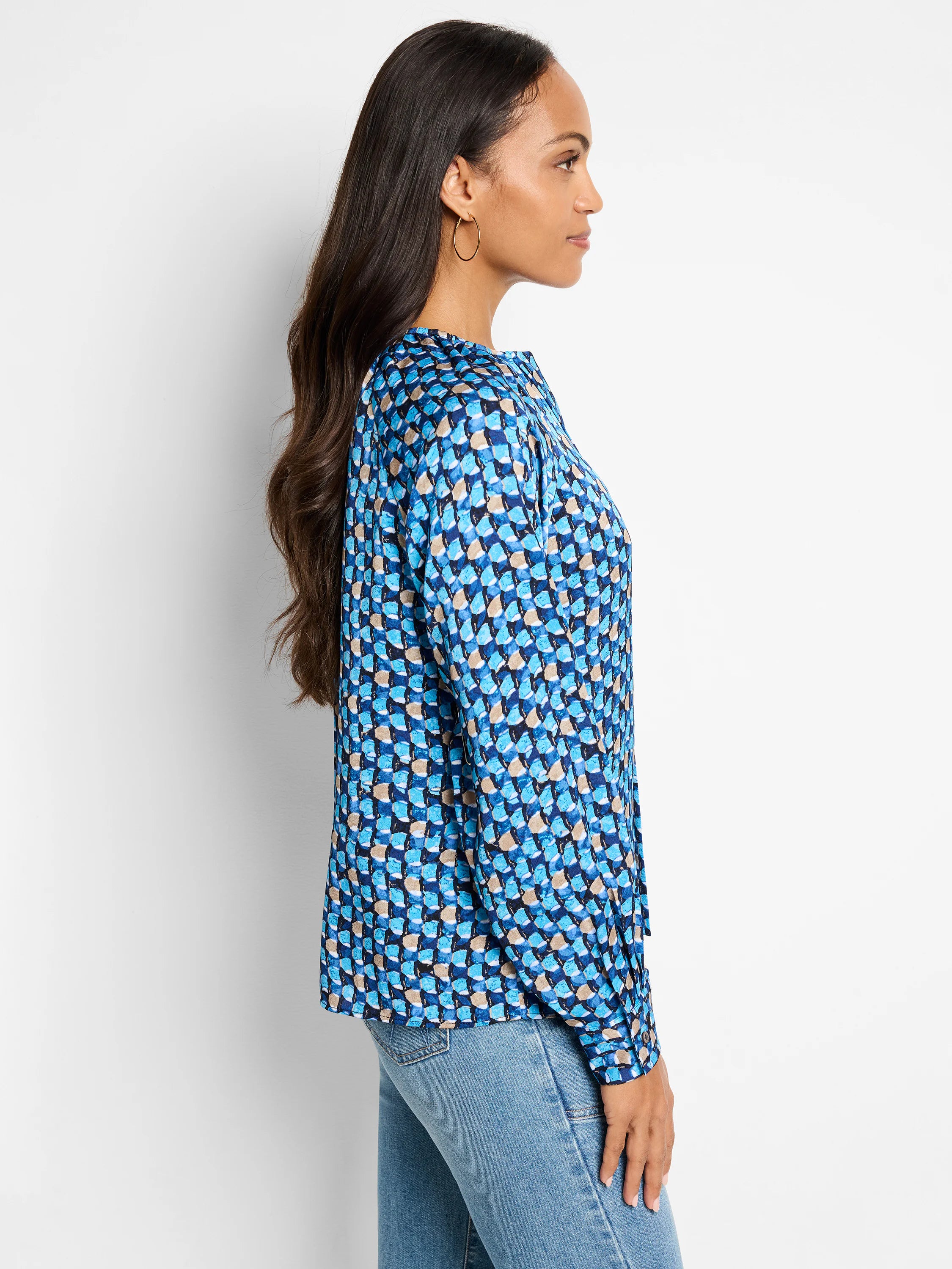 Blue, beige, and dark-blue patterned long-sleeve top.  Geometric print.