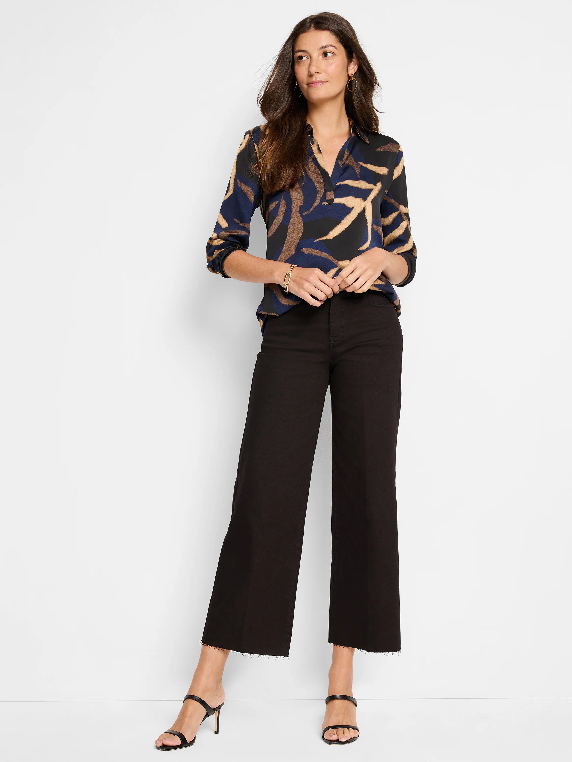 Dark blue, beige, and brown abstract print long-sleeved shirt; collared neckline.