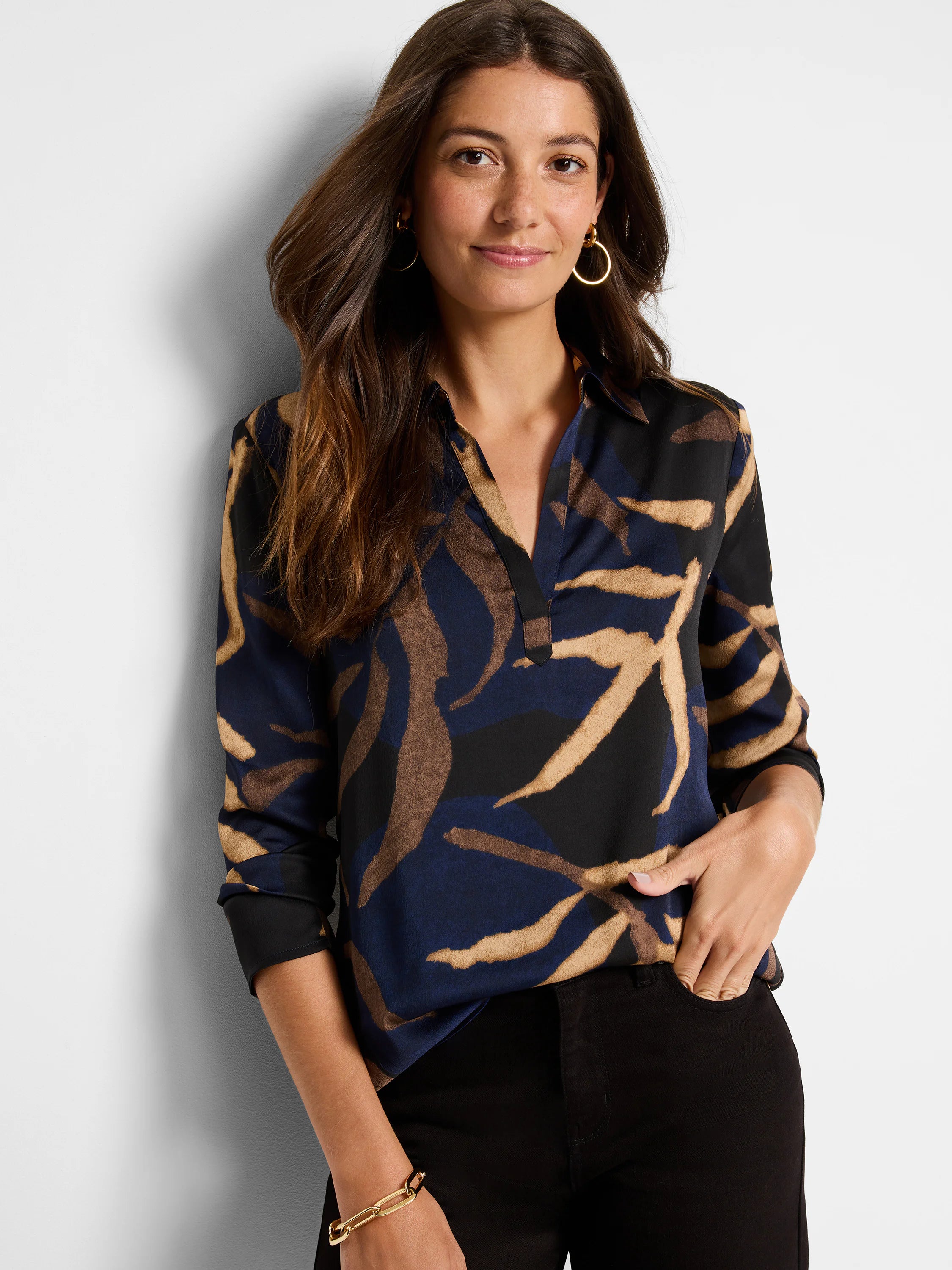 Navy, black, and tan abstract leaf print blouse.  Three-quarter sleeves, collared neckline.
