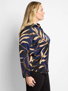 Navy, black, and beige long-sleeved shirt. Abstract leaf print. Collared.