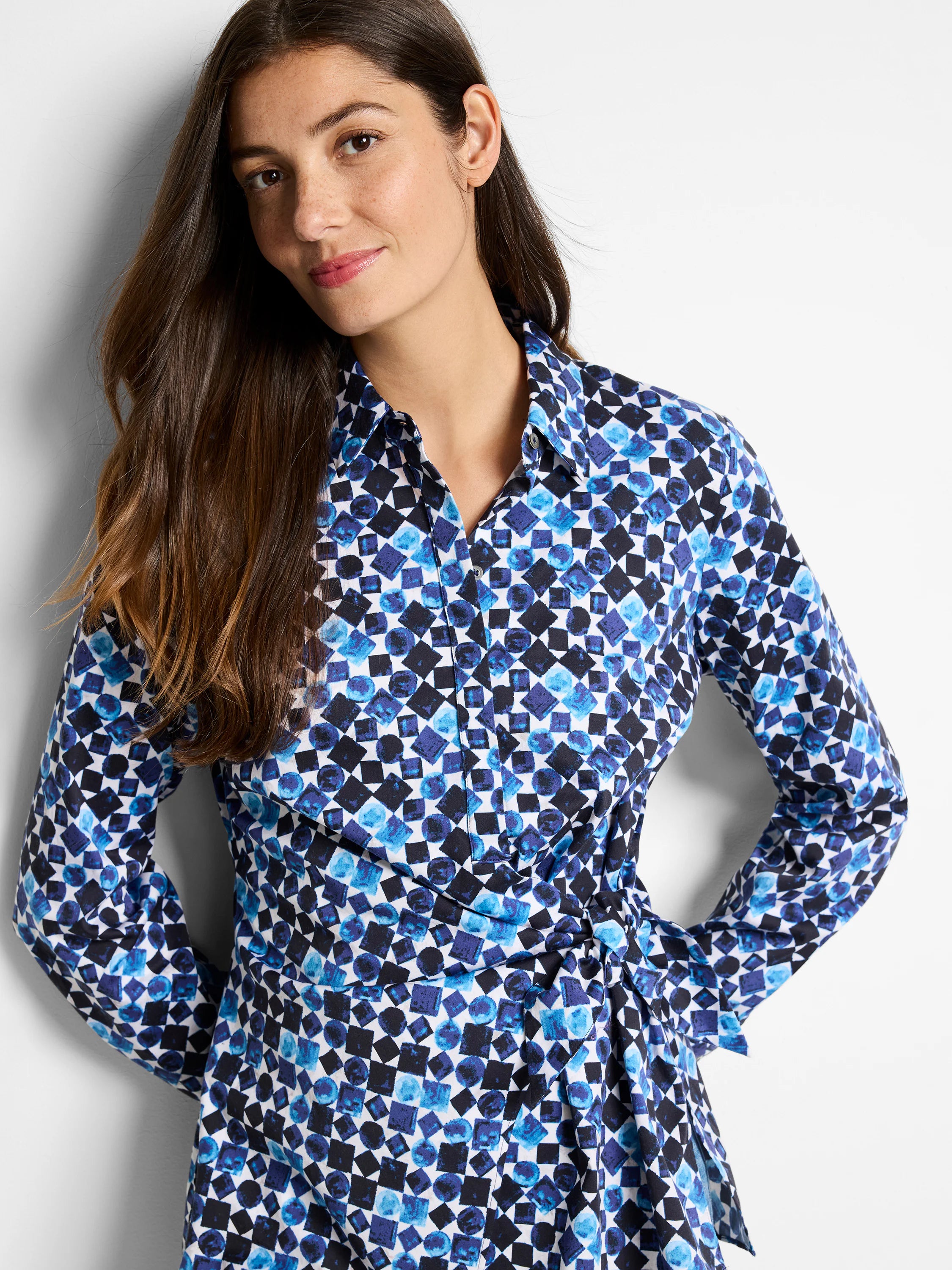 Long-sleeve collared shirt with side tie.  Blue, black, and white geometric print.