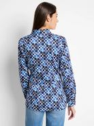 Blue and black abstract print long-sleeve shirt with side tie.  White background.