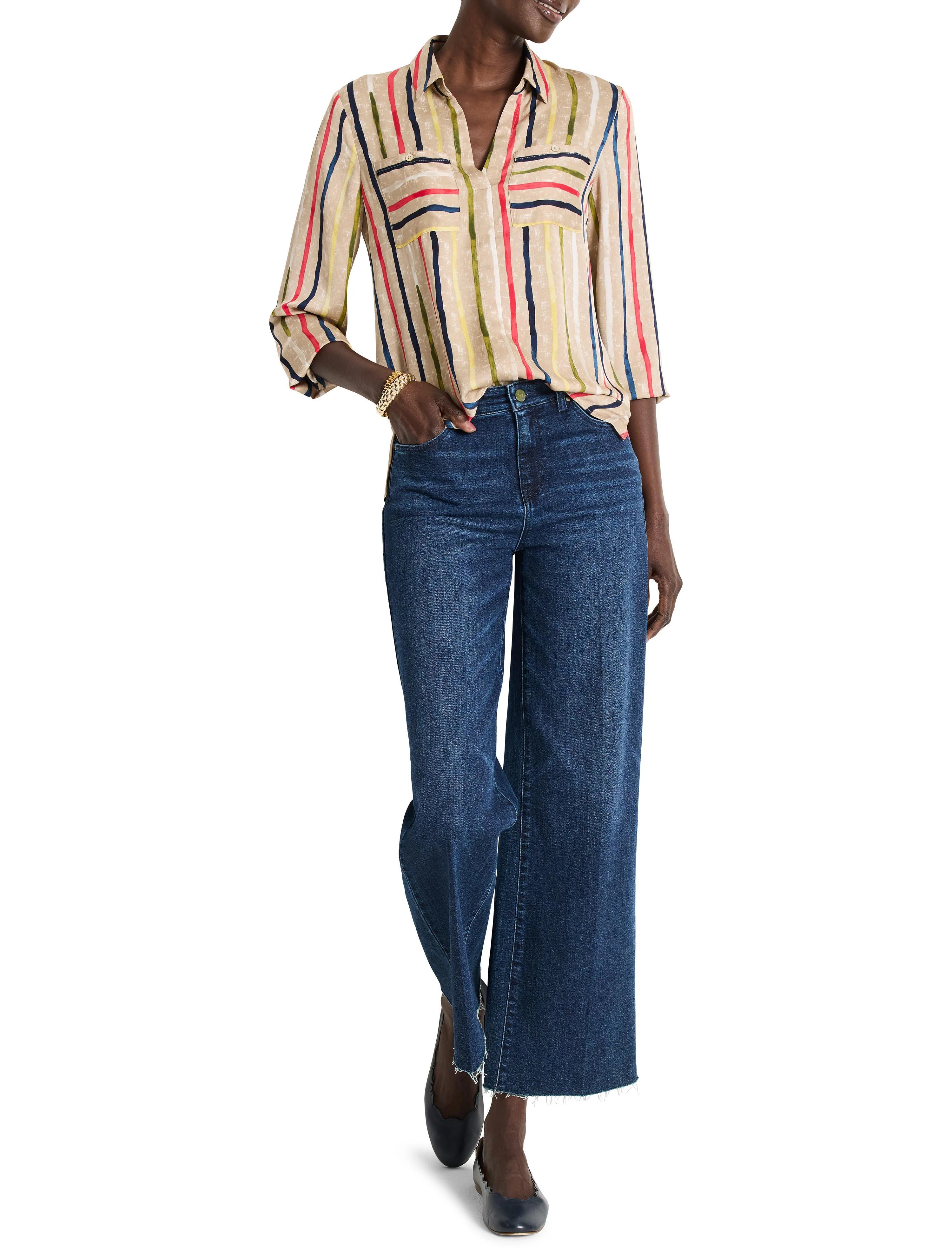 Beige collared top with vertical painted stripes: red, navy, yellow, green. Two chest pockets.