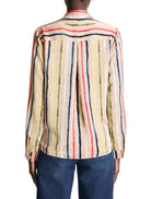 Beige long-sleeve top with painted vertical stripes in red, blue, yellow, green, and white. Model's back.