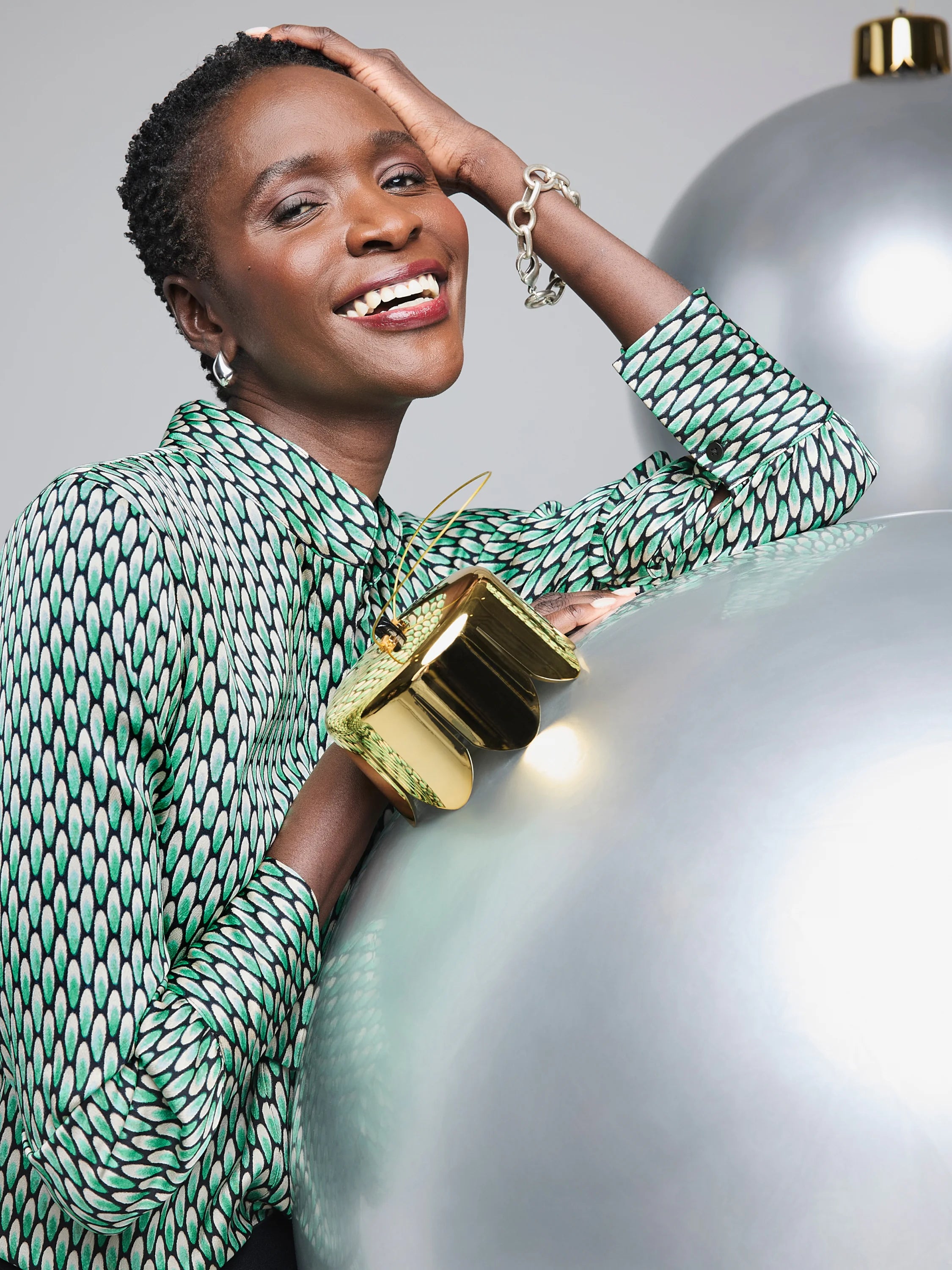 Abstract Dot Top: Green, white, and black abstract dot pattern on a long-sleeved shirt.