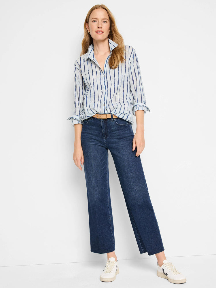 Blue watercolor stripes on a light blue, collared, long-sleeve shirt.