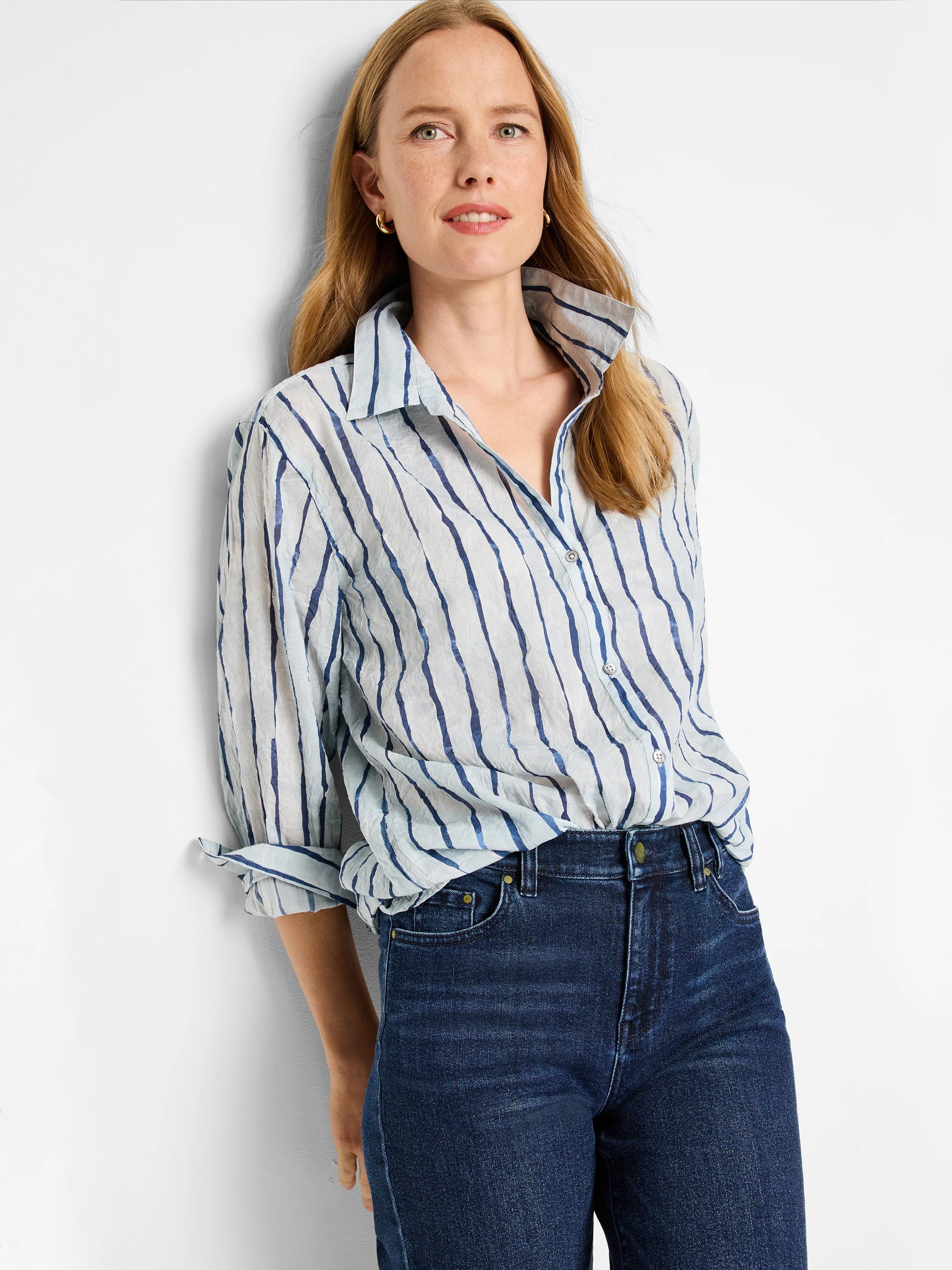 Light blue shirt with dark blue watercolor stripes, long sleeves, button-down front.