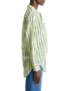 Lime green shirt with vertical blue watercolor stripes.  Long sleeves, collared.