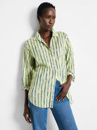 Lime green shirt with vertical dark teal stripes;  long sleeves, button-down.