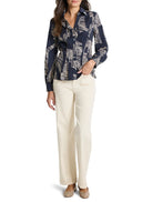 Here's alt text for the image, under 125 characters:

"Dark navy blue, long-sleeve button-down shirt with beige zebra...