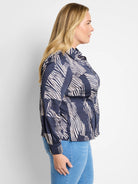 Dark navy shirt with off-white zebra stripes. Long sleeves, collared.