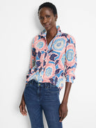 Cotton shirt; pink, blue, and dark-blue floral print on a crinkled fabric.  Long sleeves, button-down.