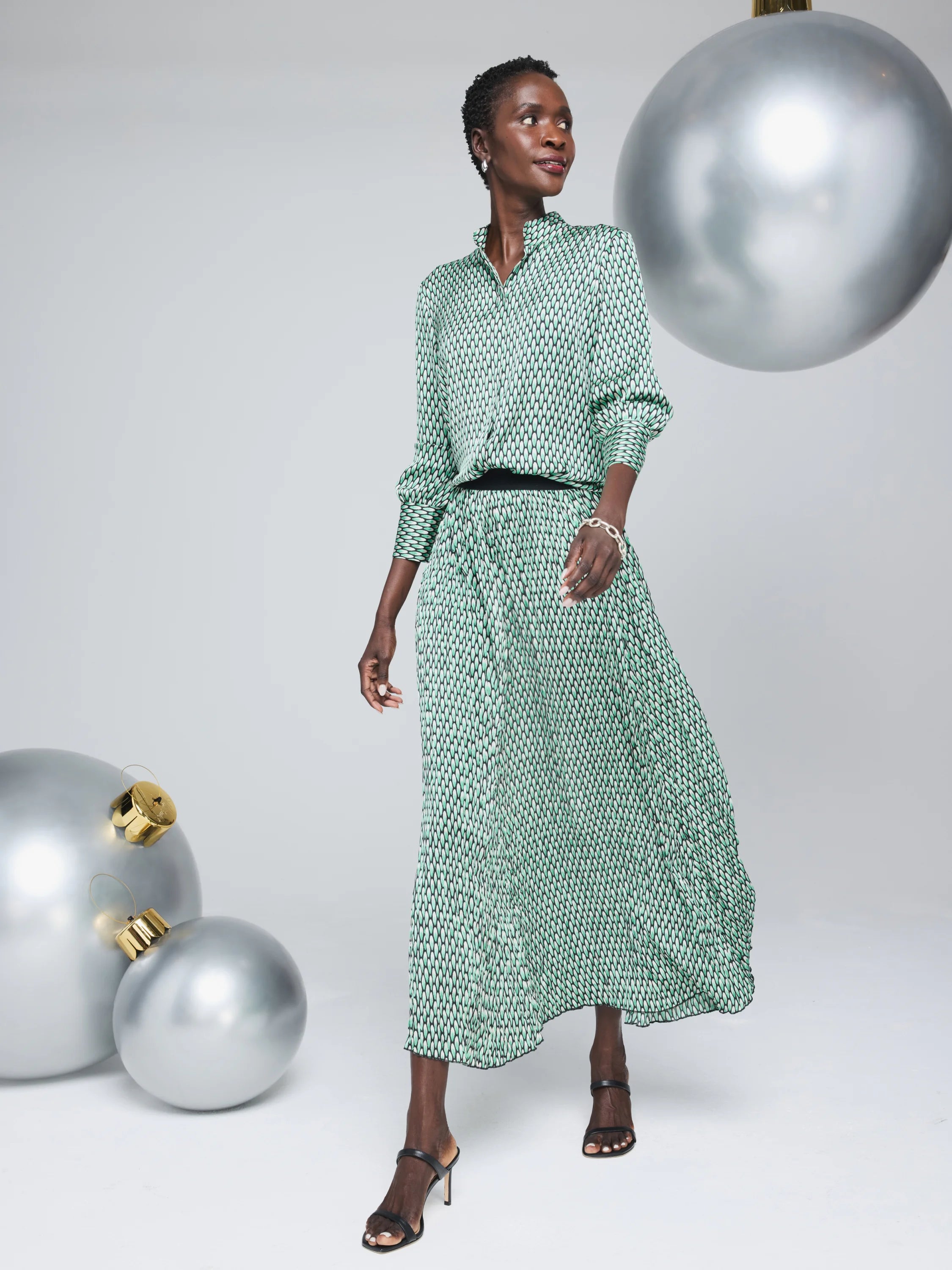 Green and black abstract dot pleated maxi skirt.