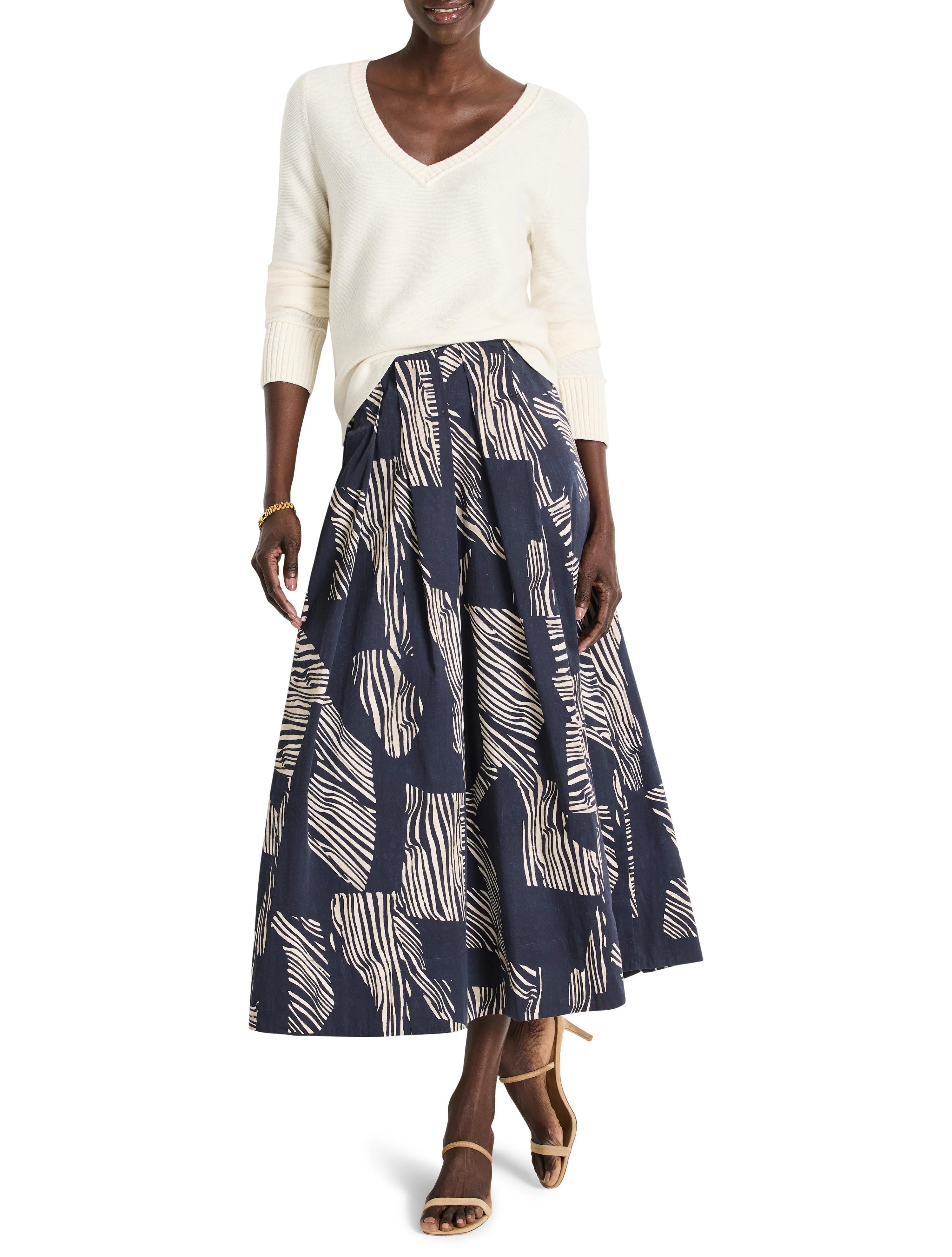 Midi-length pleated skirt in navy blue with off-white zebra-stripe pattern.