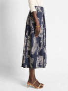 Midi-length skirt, navy blue background with off-white zebra-like stripes in an abstract pattern.