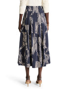 Mid-length pleated skirt; navy blue background with off-white zebra stripes.