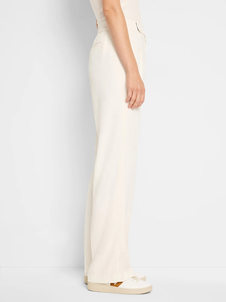 Off-white wide-leg trousers;  pleated front, shown on a model.