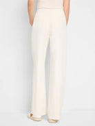 Off-white wide-leg trousers, pull-on waist.  Back view.