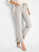 Light gray jeans with a gentle bootcut flare and frayed hems.