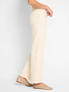 Ecru high-rise wide-leg jeans, side view, showing visible pockets with contrasting tan topstitching.