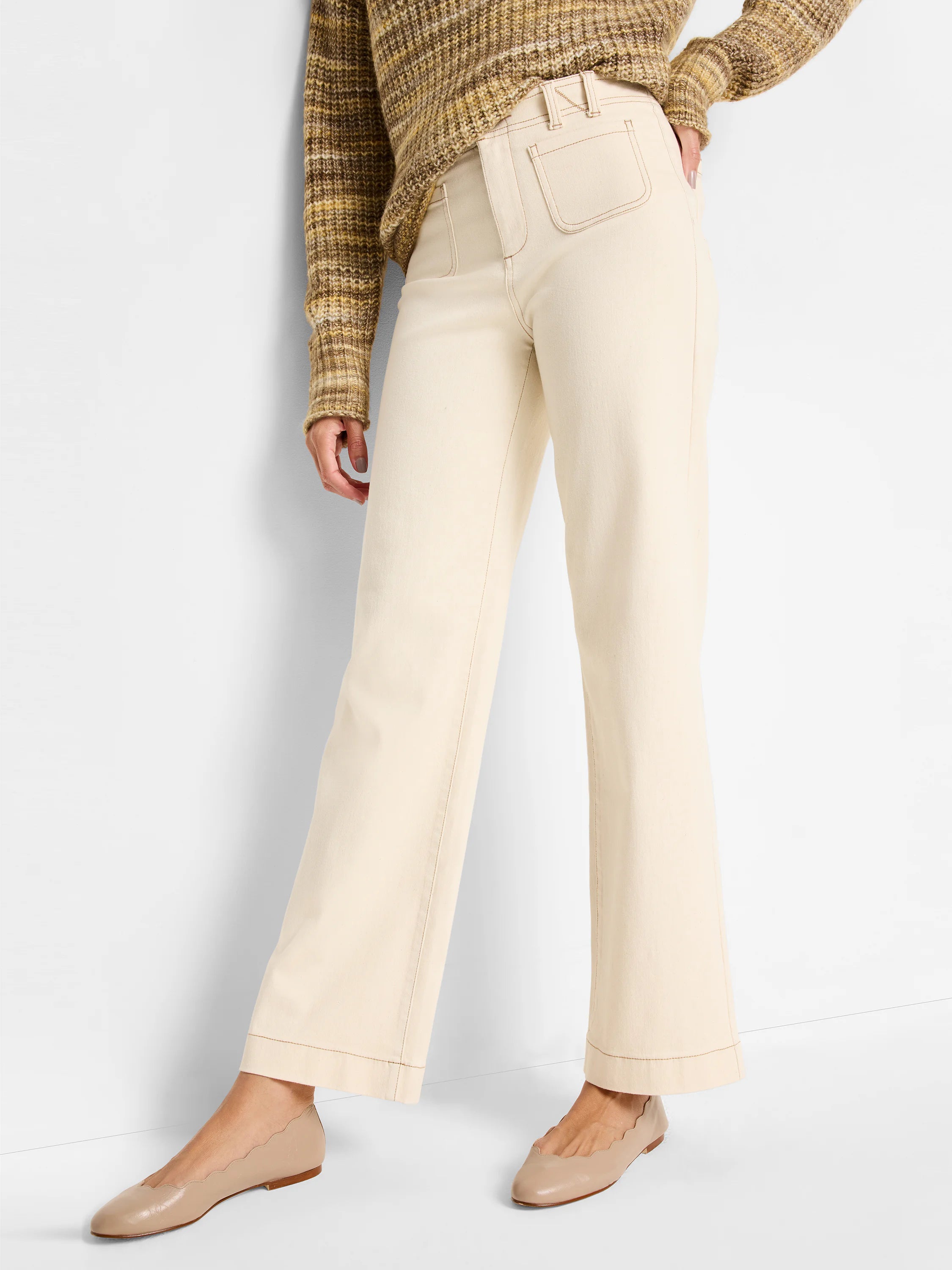 Cream wide-leg high-rise jeans with visible brown contrast stitching on front patch pockets, waistband, and seams.