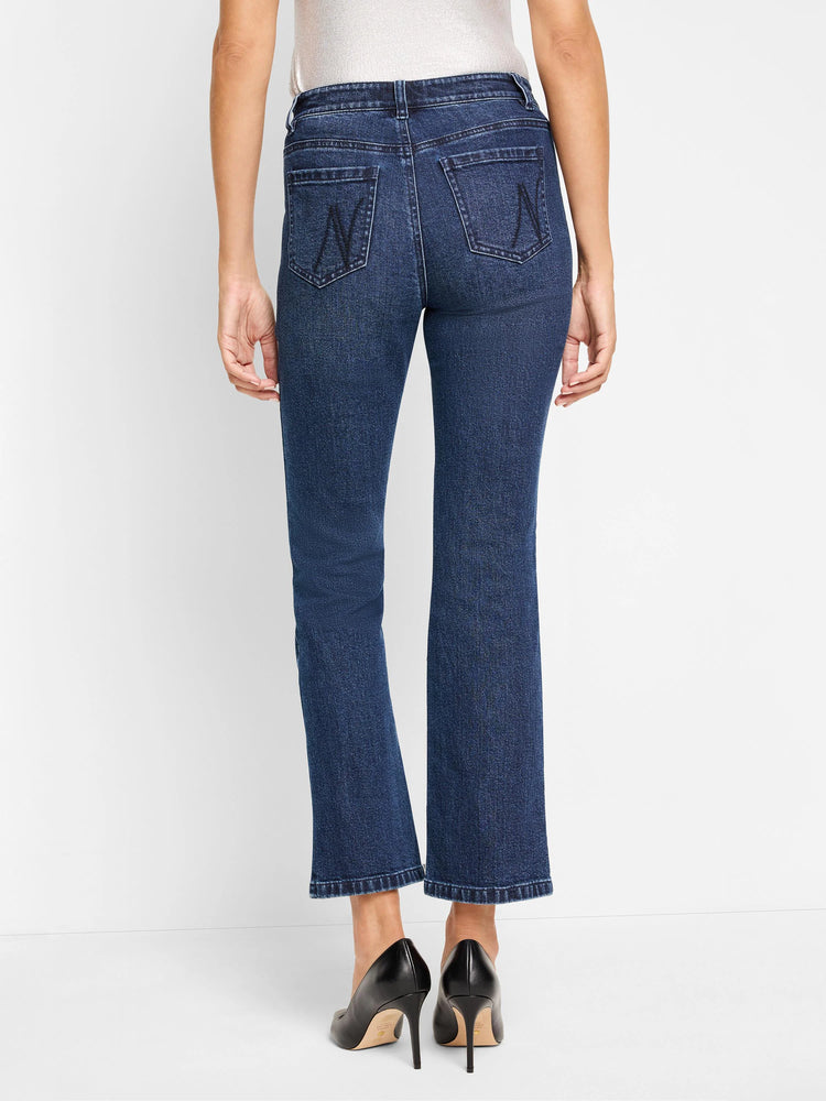 Dark wash denim bootcut jeans; back view shows two back pockets with subtle stitching detail.