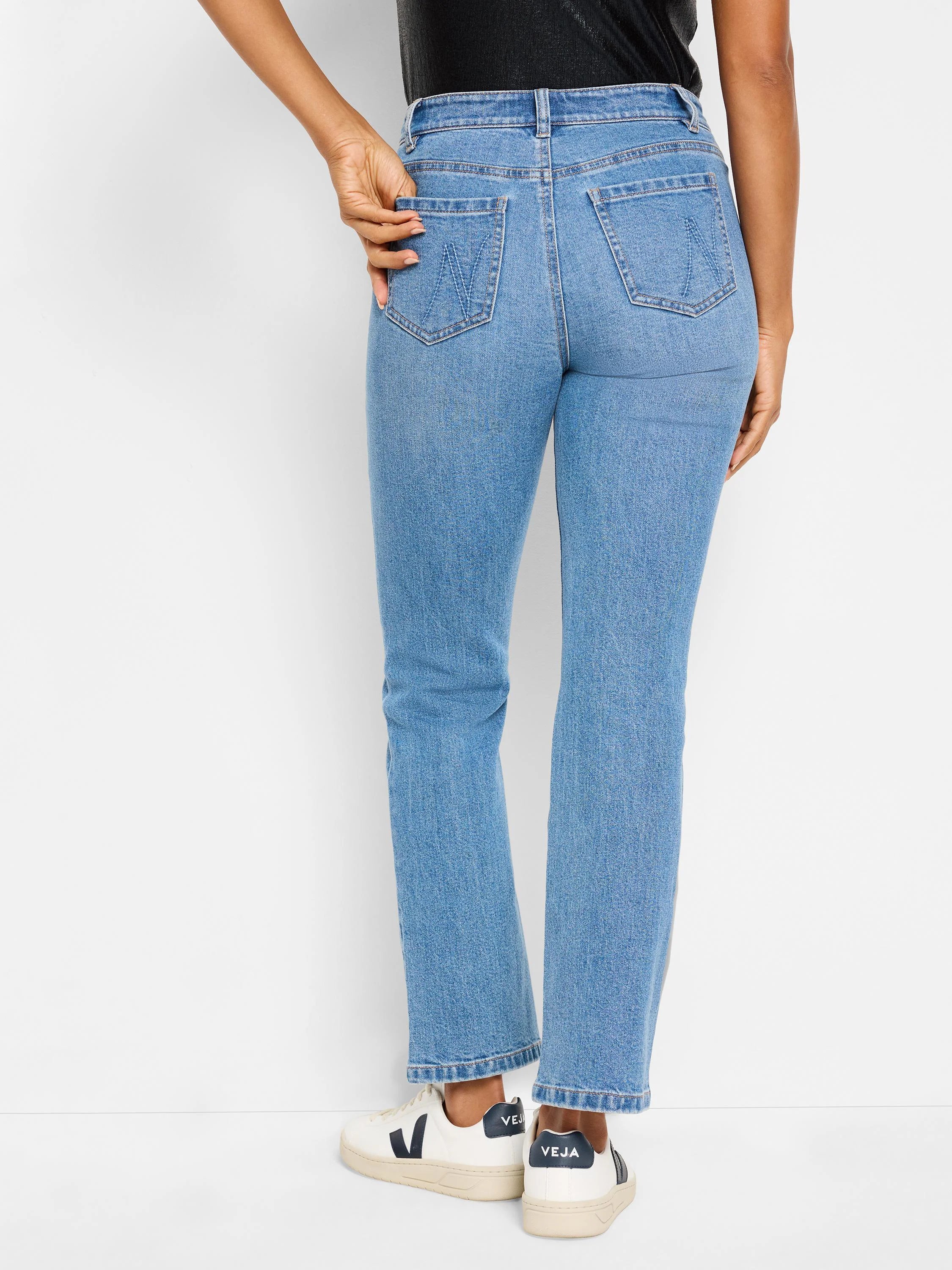 Light wash, straight-leg jeans with back pockets.  The jeans are shown from the back.