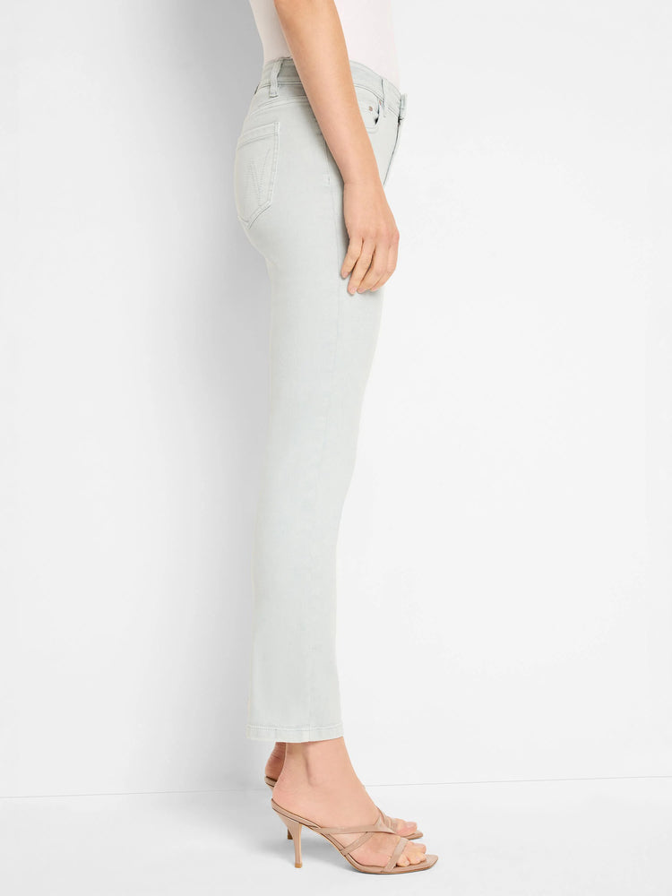 Pale blue, slim straight ankle jeans on a model, showing a cropped hem.
