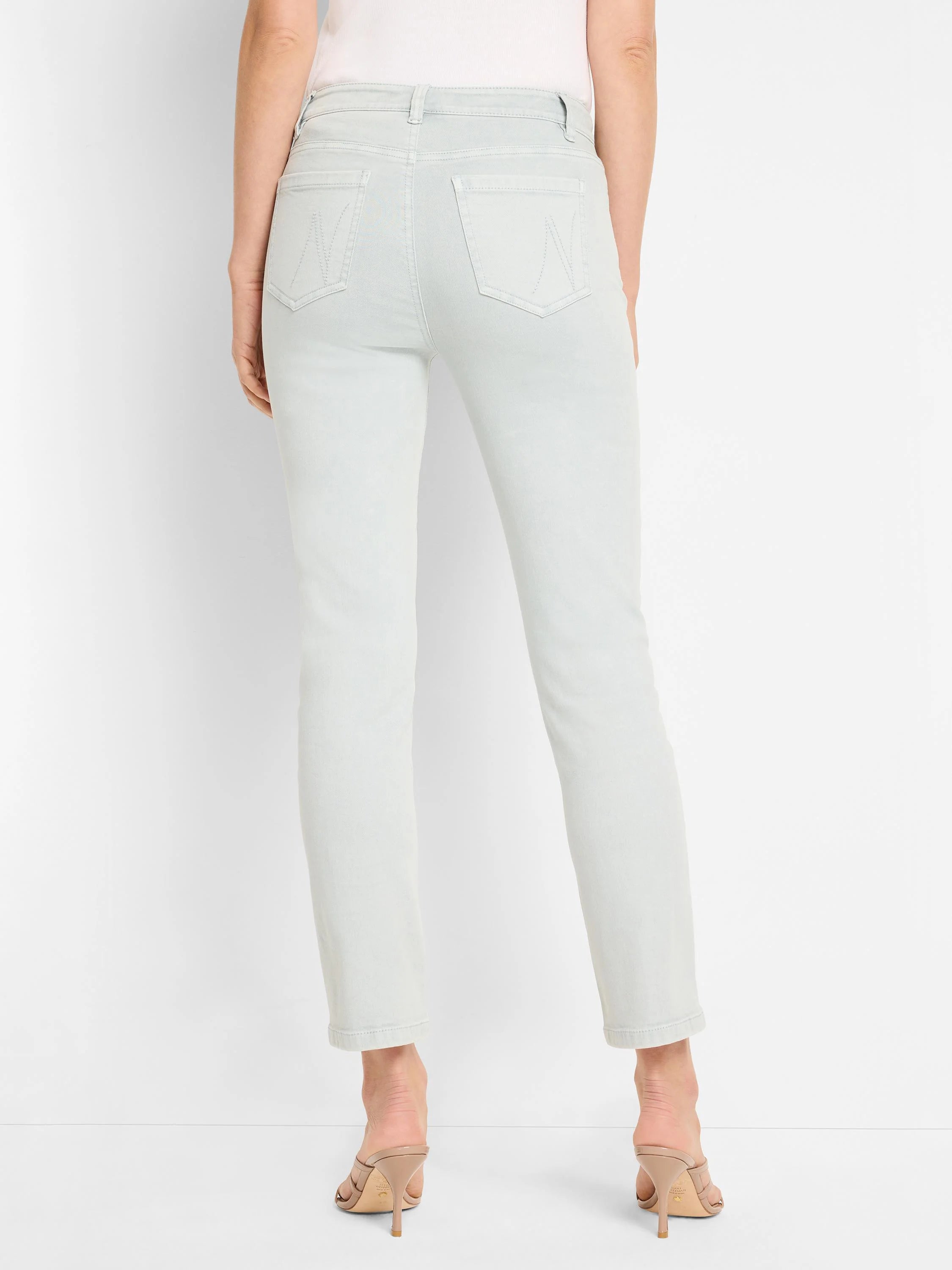 Pale grey-green straight ankle jeans, back view, featuring stitched rectangular back pockets.