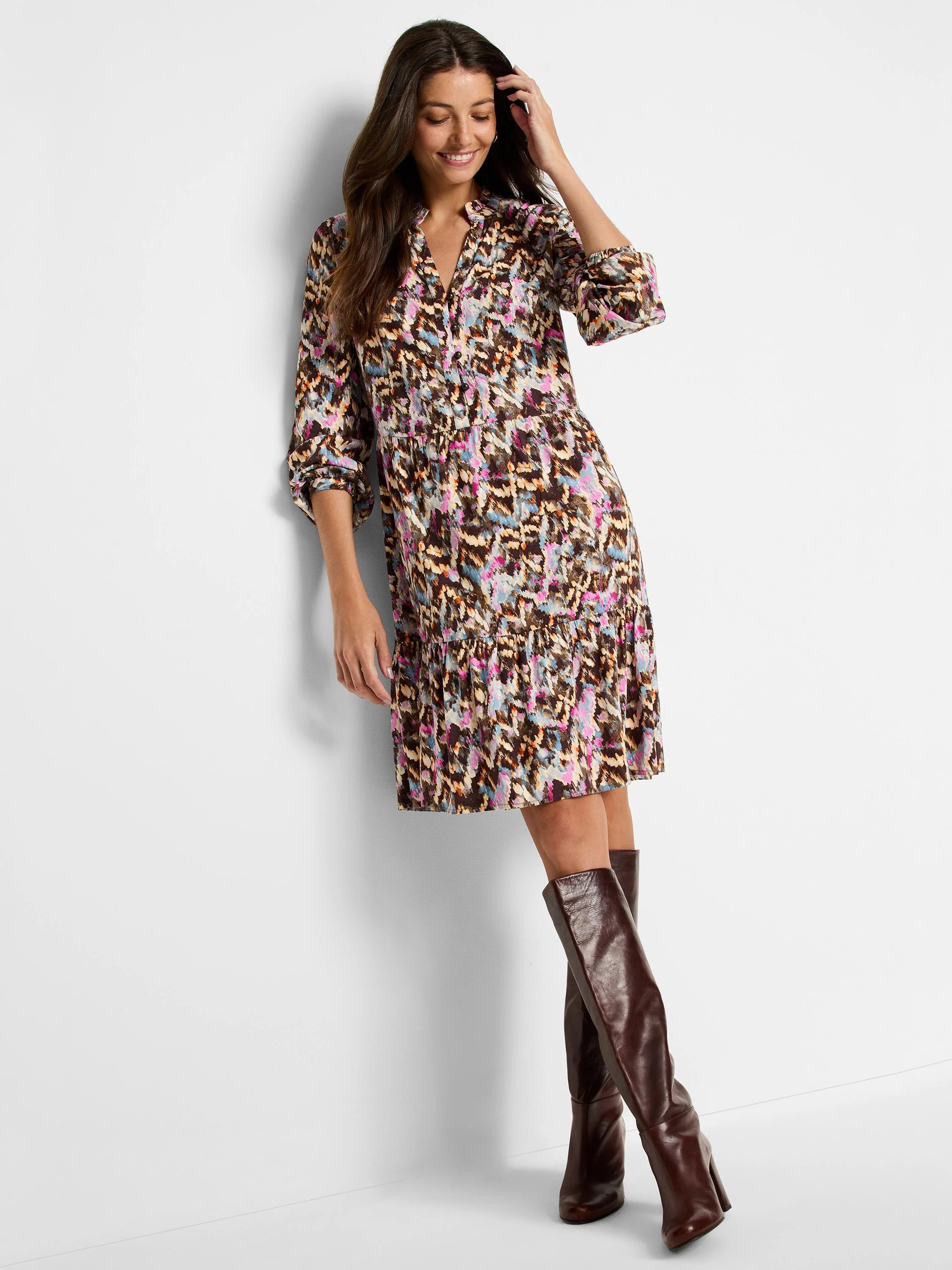 Brown mini dress with pink, blue, and beige abstract print.  Three-quarter sleeves, collared neckline.