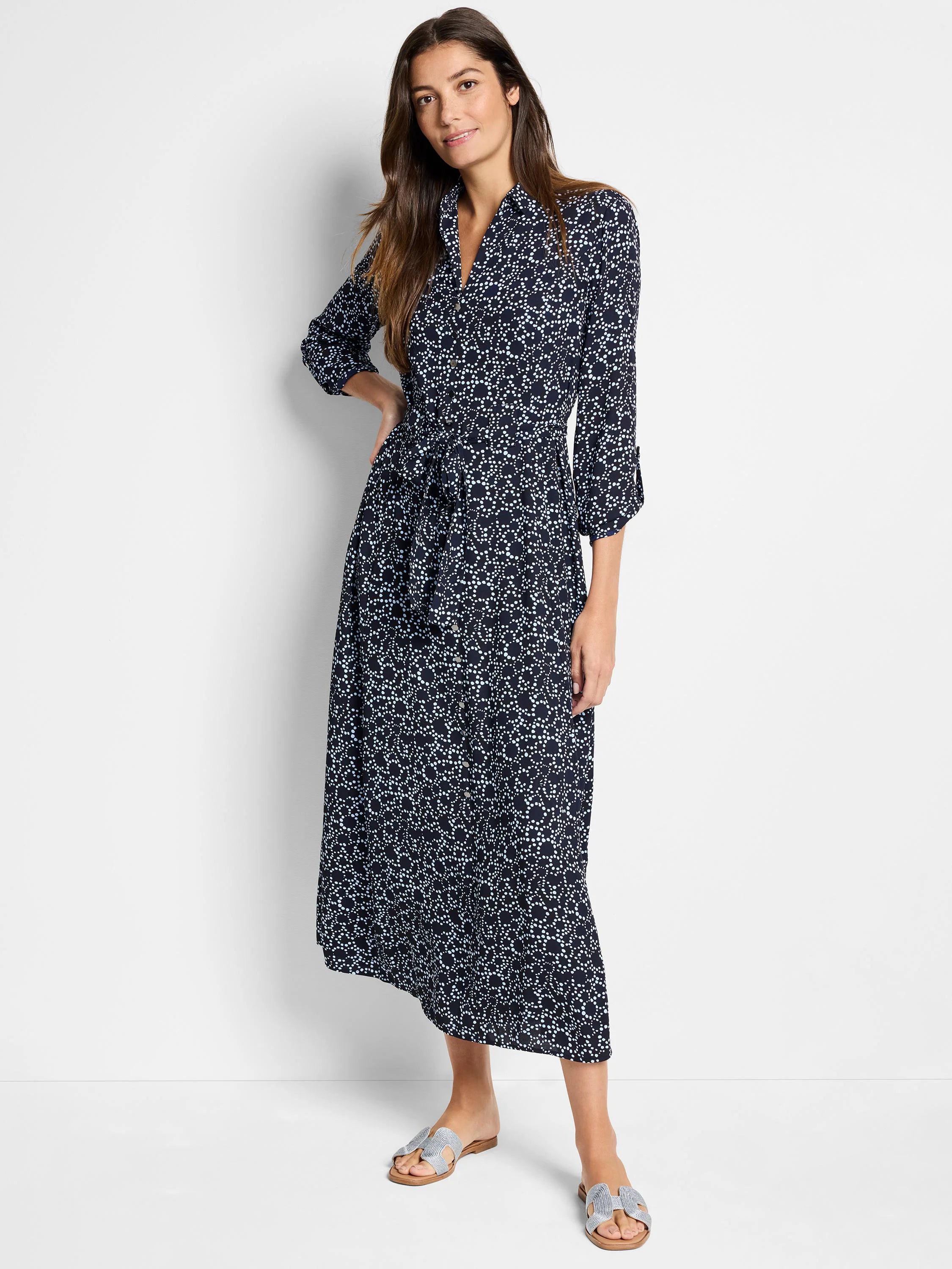 Navy midi dress with light blue dot pattern, collared, 3/4 sleeves, belted waist.