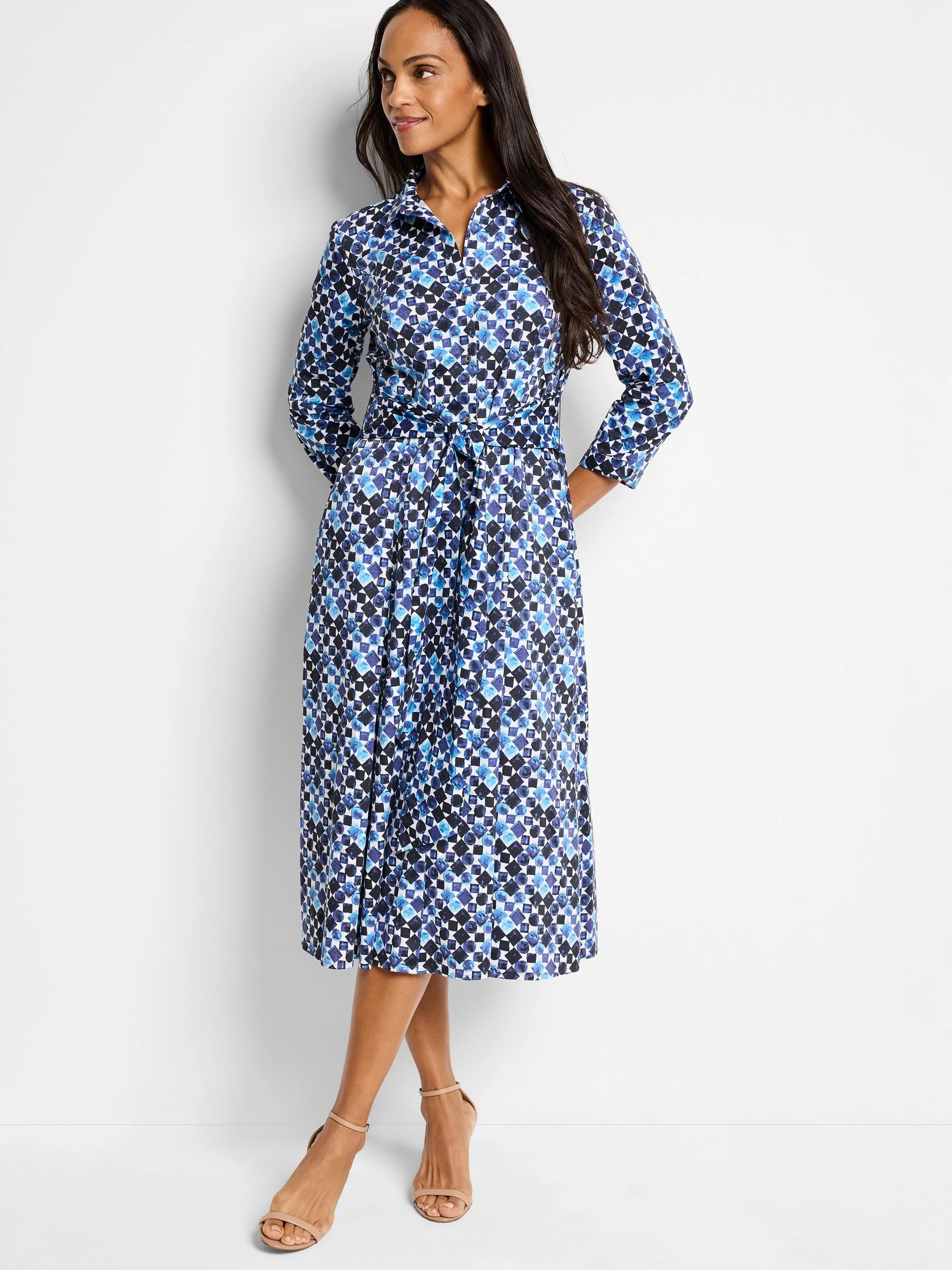 Blue and white geometric print midi shirt dress with 3/4 sleeves and tie waist.