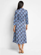 Blue and white patterned midi shirt dress.  Geometric print with darker and lighter blues. Three-quarter sleeves, collared.