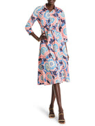 Pink midi shirt dress with blue, teal & cream floral print.  Three-quarter sleeves, belted waist.