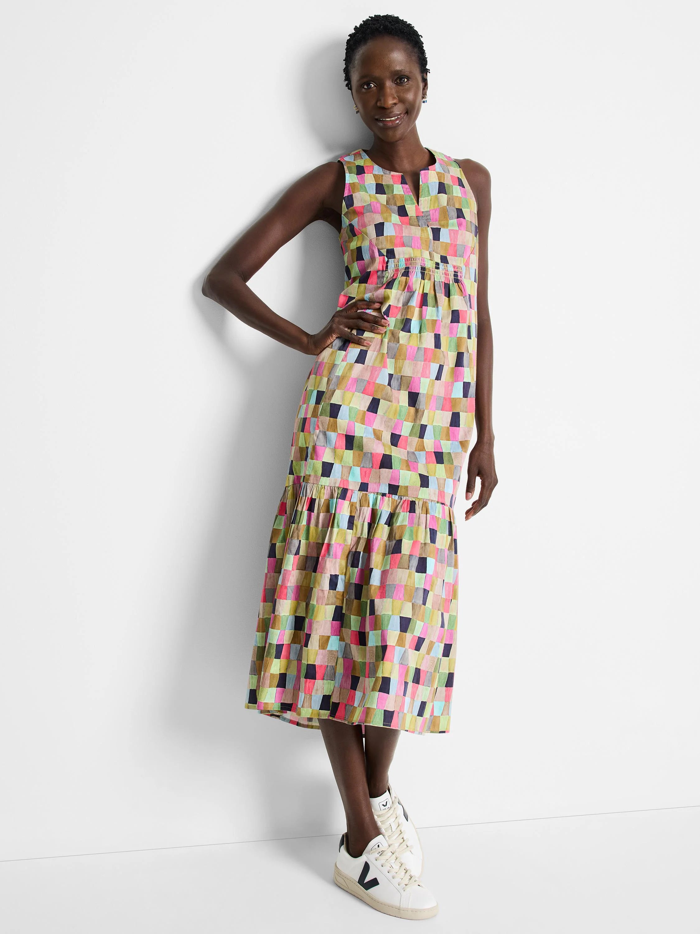 Midi dress, sleeveless, V-neck.  Multicolored geometric print featuring pinks, greens, and blues.  Tiered skirt.