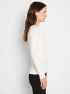 Cream long-sleeve ribbed knit V-neck top.