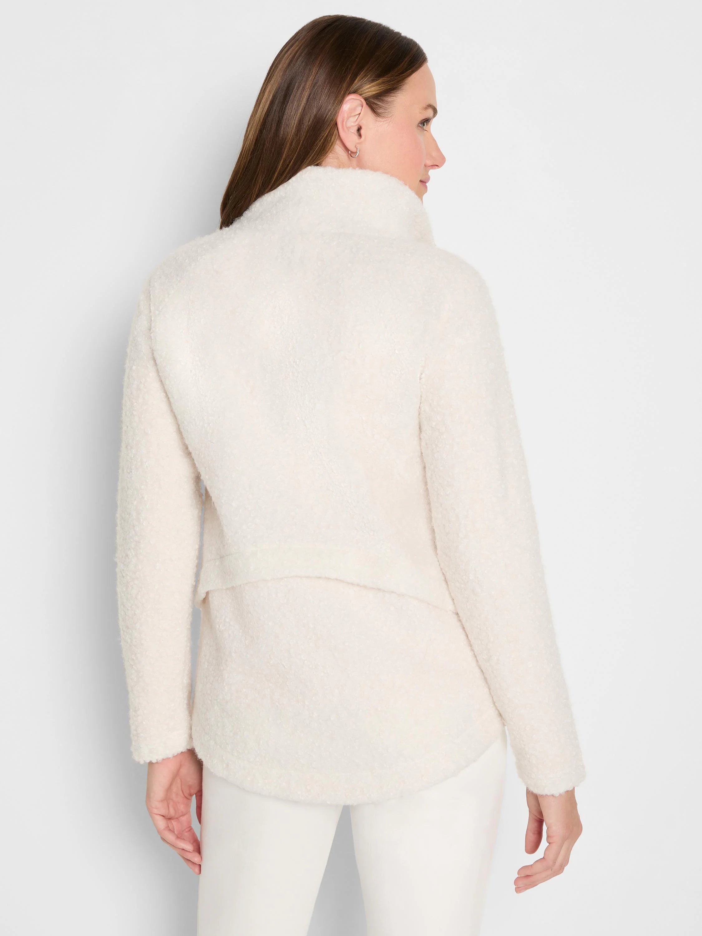 Cream curly boucle jacket, mock neck, long sleeves, shown from the back on a model.