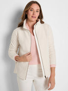 Cream boucle jacket with full-zip front and stand collar.