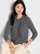 Navy & grey textured stripe long-sleeve top with decorative bronze buttons on the shoulders.