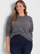 Textured navy and light grey stripe top with gold buttons on the shoulder.