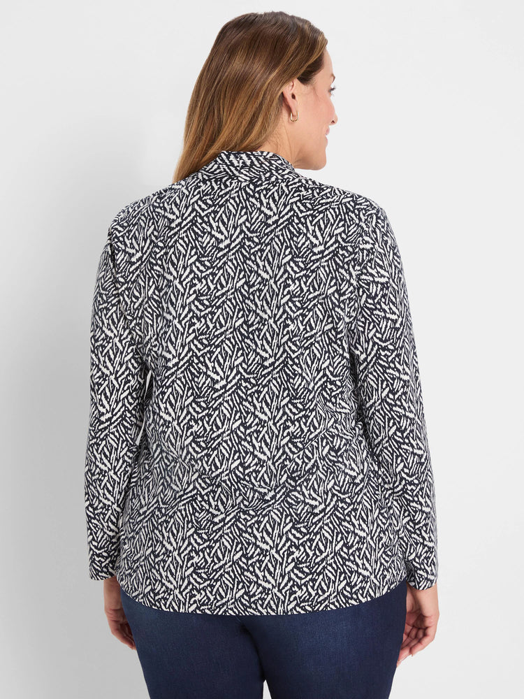 Navy and white Geo Toss patterned knit top, long sleeves. Back view.